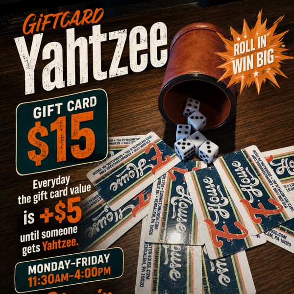 Yahtzee gift card promotion with dice, a leather cup, and gift cards on a wooden table.