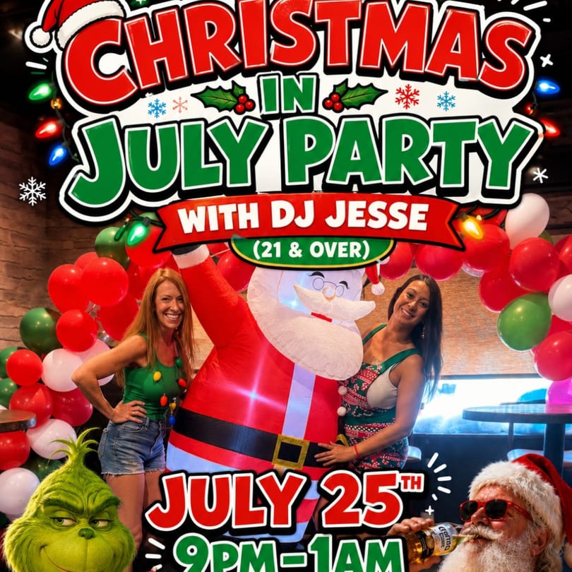 Two women pose with an inflatable Santa and balloons at a "Christmas in July" party.